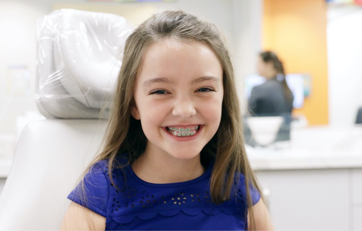 young girl with braces smiling